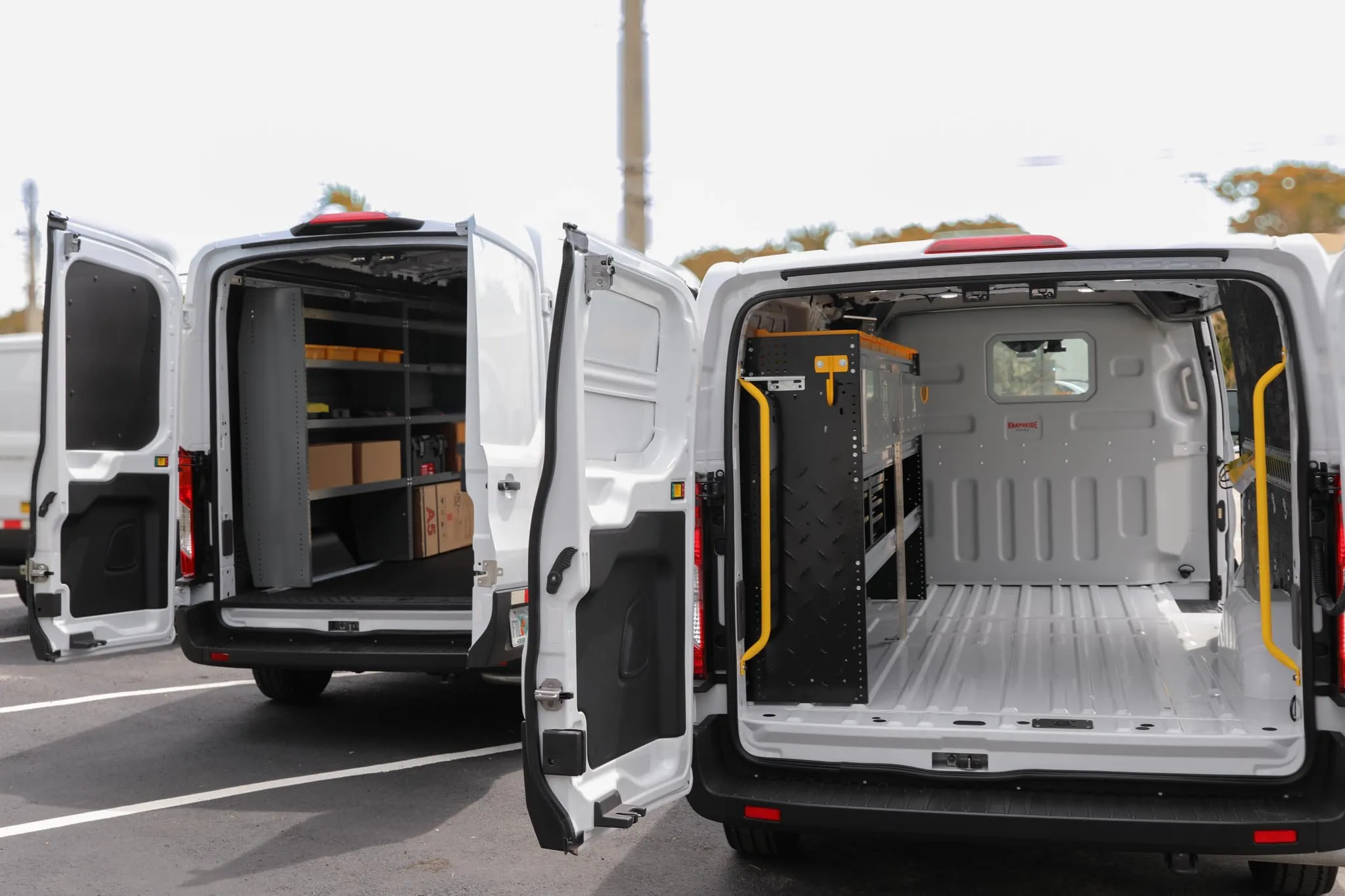 Rear doors of the Ford Transit 250 low roof open, showing the cargo floor